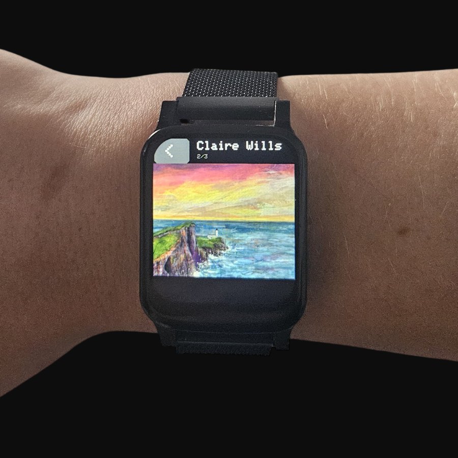 On the wrist, showing a painting by Claire Wills