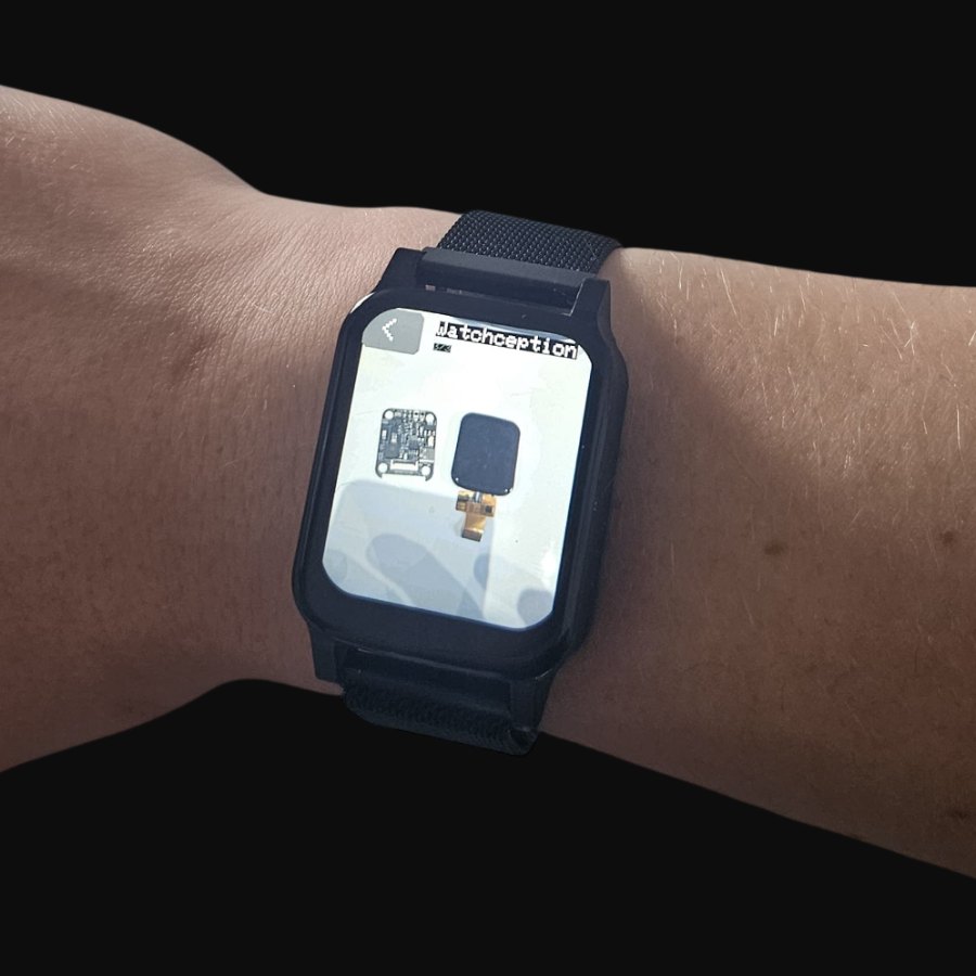 On the wrist, showing a photo of itself
